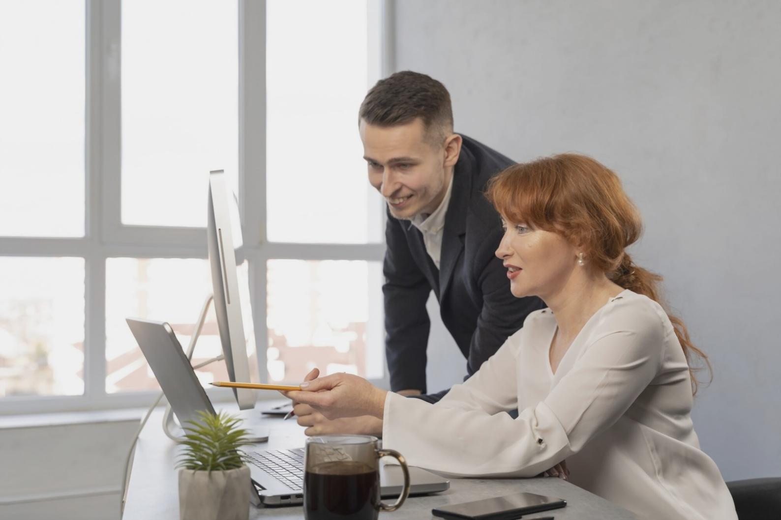 Person reviewing financial documents and planning budget